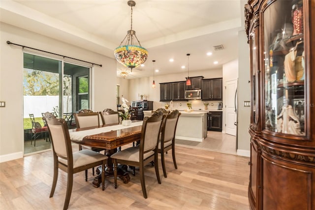 dining room with recessed lighting, visible vents, baseboards, and light wood-style flooring