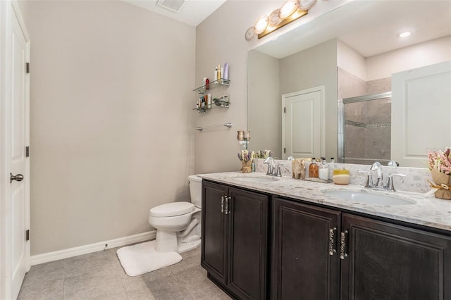 full bath with a shower stall, toilet, baseboards, and a sink