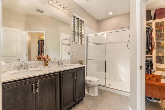 full bathroom with a sink, visible vents, toilet, and a shower stall