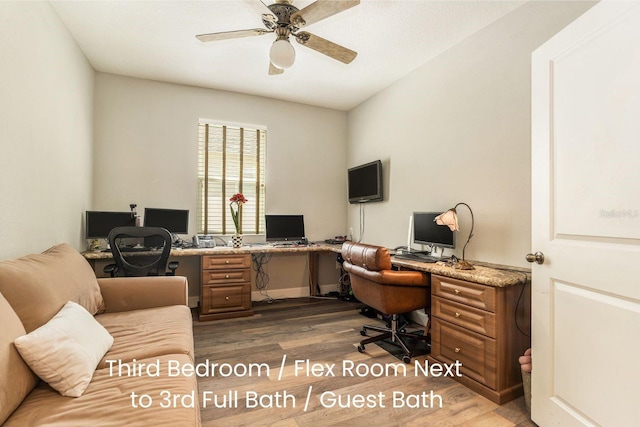 office with dark wood finished floors and a ceiling fan