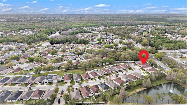 drone / aerial view featuring a residential view and a water view