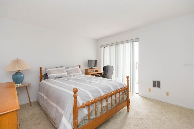 bedroom featuring light colored carpet, visible vents, and baseboards