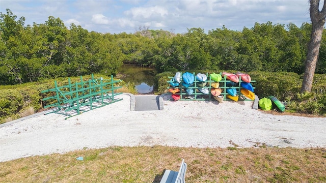 view of jungle gym featuring a water view