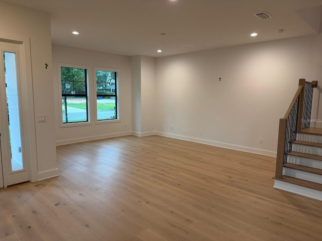 418 W Frances Ave Unit 2, Tampa, FL 33602 - empty room featuring light wood-type flooring, stairs, recessed lighting, and baseboards