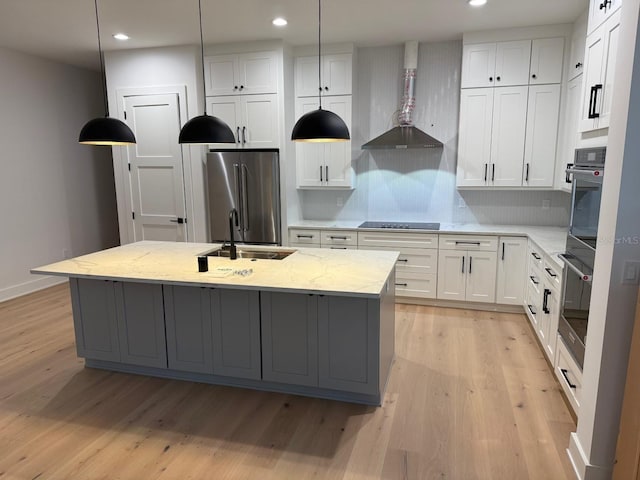 418 W Frances Ave Unit 2, Tampa, FL 33602 - kitchen with stainless steel appliances, a sink, light wood-style floors, recessed lighting, and a kitchen island with sink