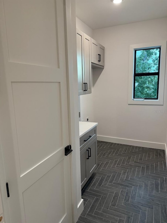 418 W Frances Ave Unit 2, Tampa, FL 33602 - laundry room featuring cabinet space, baseboards, and electric dryer hookup