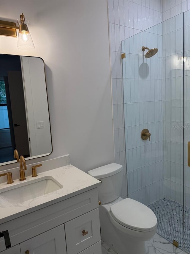 418 W Frances Ave Unit 2, Tampa, FL 33602 - bathroom featuring vanity, a shower stall, marble look tile flooring, and toilet