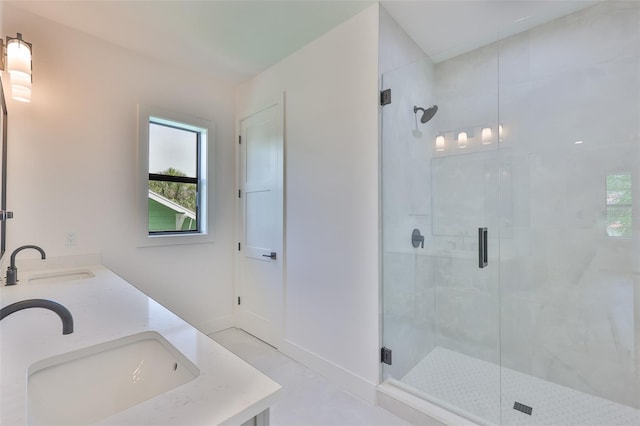 418 W Frances Ave Unit 2, Tampa, FL 33602 - bathroom featuring a stall shower, healthy amount of natural light, and double vanity