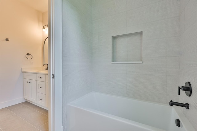 418 W Frances Ave Unit 2, Tampa, FL 33602 - bathroom featuring vanity, tile patterned flooring, baseboards, and washtub / shower combination