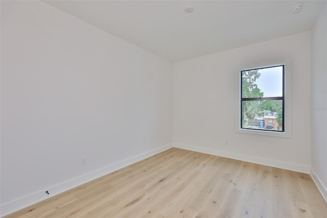 418 W Frances Ave Unit 2, Tampa, FL 33602 - unfurnished room featuring light wood-type flooring, baseboards, and a smoke detector