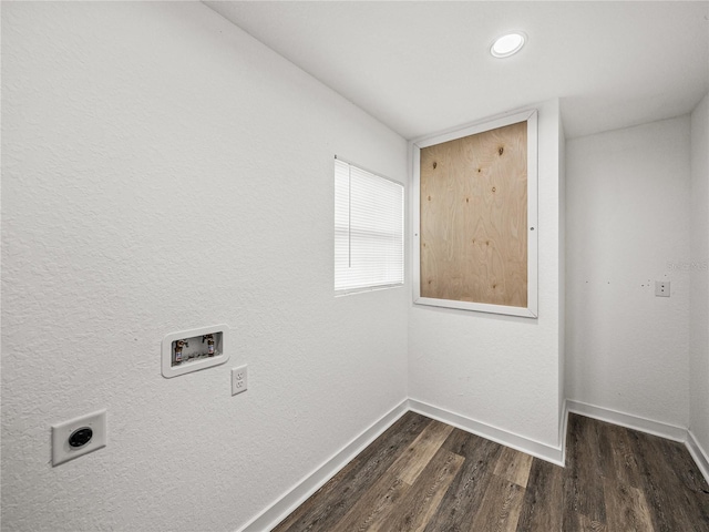 clothes washing area featuring dark wood-type flooring, baseboards, hookup for an electric dryer, hookup for a washing machine, and laundry area