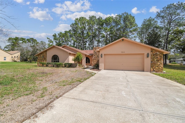 view of front of house featuring driveway, a front yard, an attached garage, and stucco siding