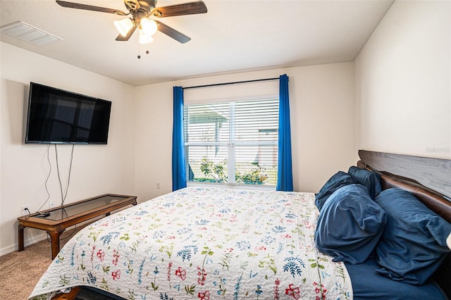 bedroom featuring ceiling fan, carpet floors, visible vents, and baseboards