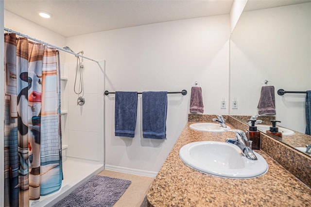 full bath featuring curtained shower and a sink