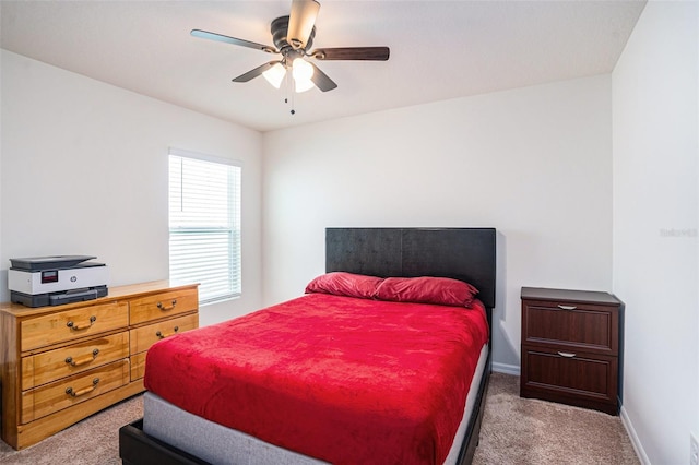 bedroom with carpet floors, ceiling fan, and baseboards