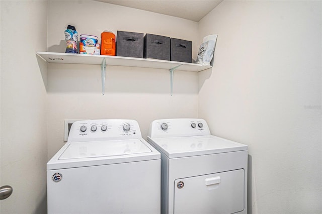 laundry area featuring washing machine and dryer and laundry area