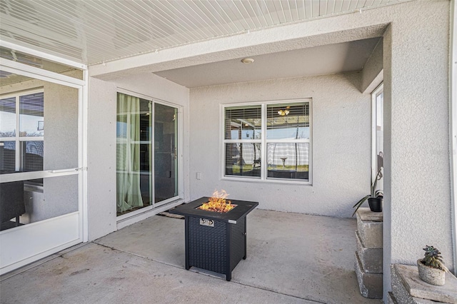 view of patio / terrace with an outdoor fire pit