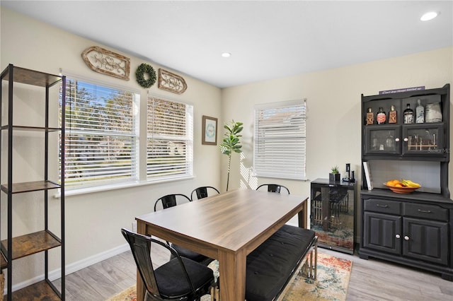 dining space featuring baseboards, recessed lighting, and light wood-style floors