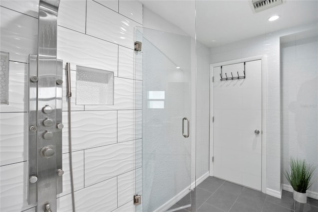 full bath featuring a stall shower, recessed lighting, visible vents, and tile patterned floors