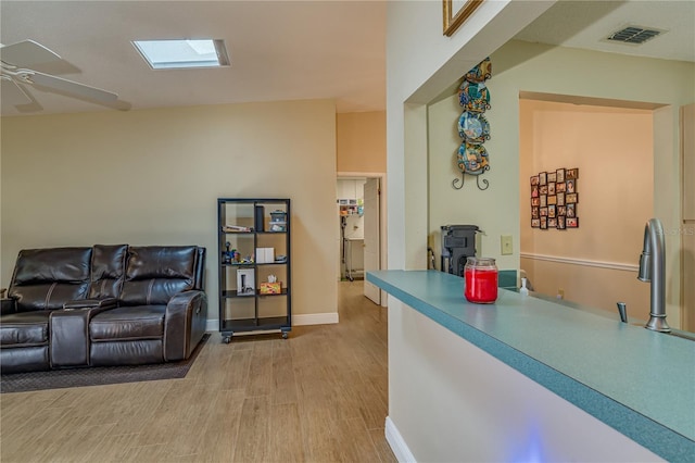 interior space featuring ceiling fan and visible vents