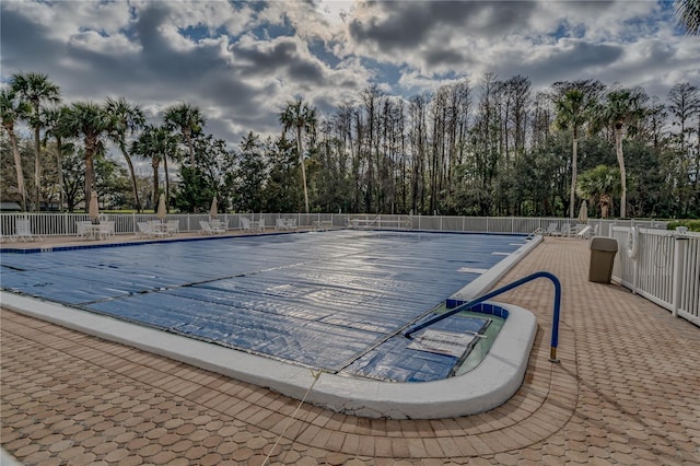 view of pool with fence