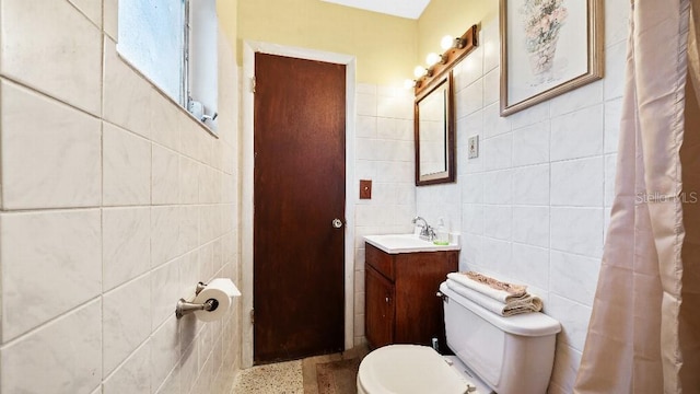 2453 Teri St, Auburndale, FL 33823 - full bathroom with toilet, vanity, and tile walls
