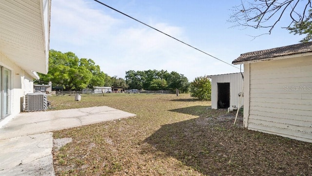 2453 Teri St, Auburndale, FL 33823 - view of yard with central air condition unit, fence, and a patio