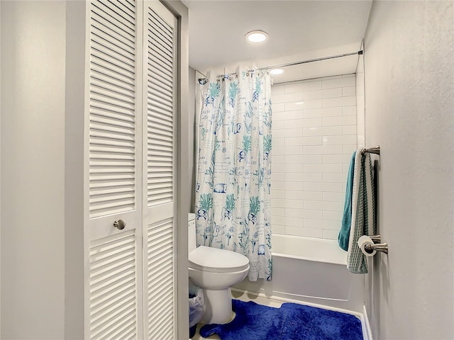 bathroom featuring shower / bath combination with curtain, a closet, and toilet