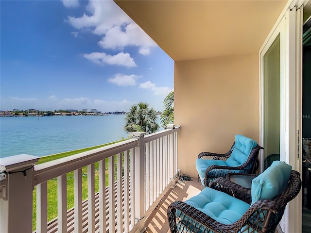 balcony featuring a water view