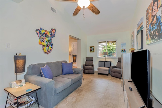 living area featuring light tile patterned floors, ceiling fan, and visible vents