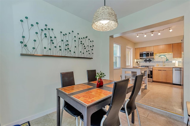 dining room featuring baseboards