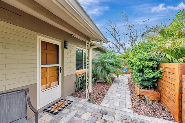 doorway to property with fence