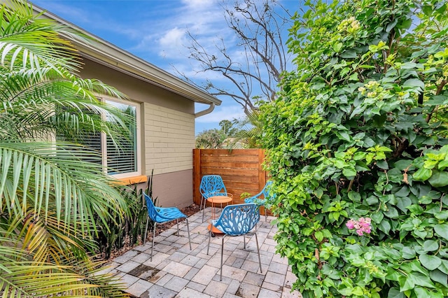 view of patio featuring fence