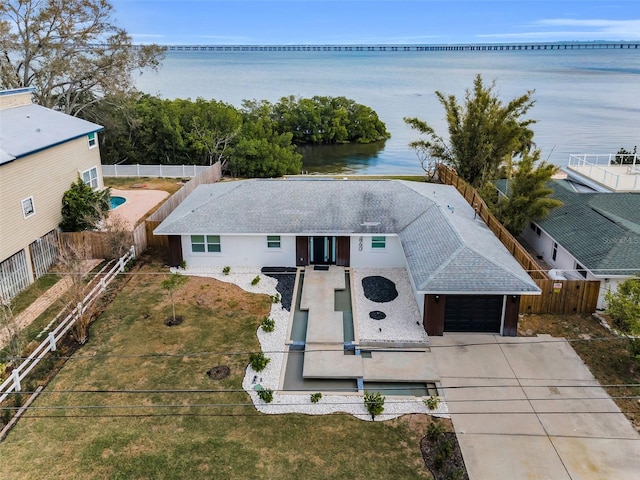 birds eye view of property with a water view