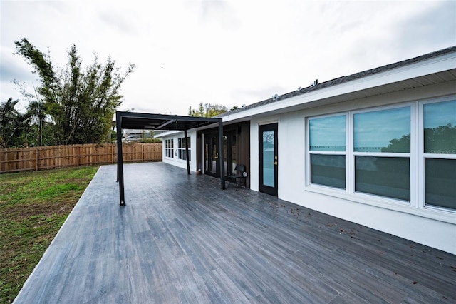 wooden terrace featuring fence