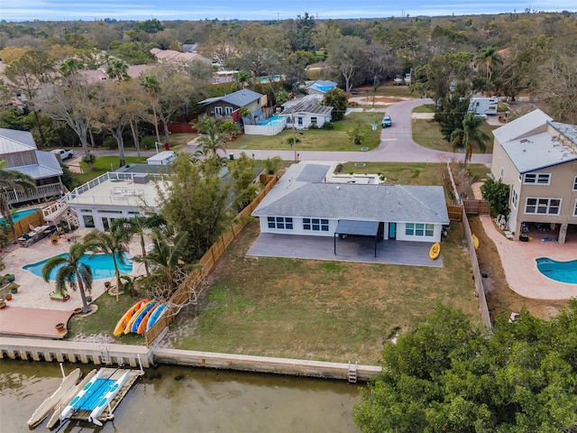 birds eye view of property featuring a water view