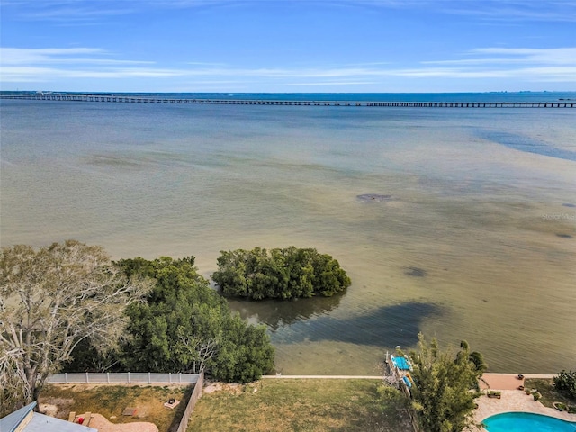 property view of water featuring fence