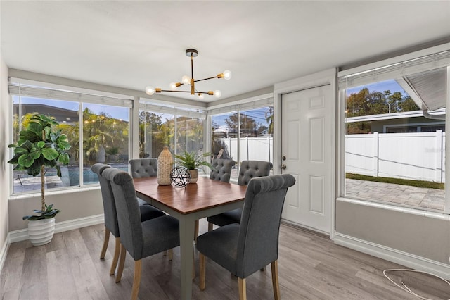 sunroom with a chandelier