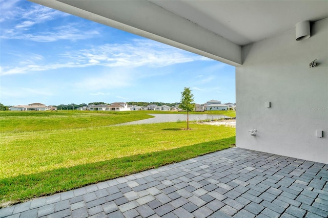 10714 Torchwood Sea Way, San Antonio, FL 33576 - view of patio / terrace featuring a residential view