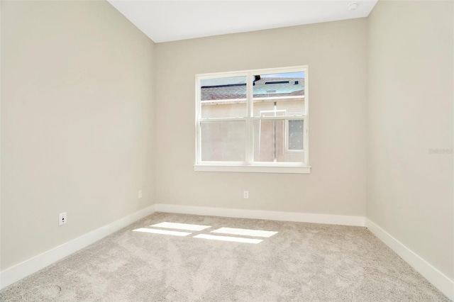 10714 Torchwood Sea Way, San Antonio, FL 33576 - empty room featuring baseboards and light colored carpet