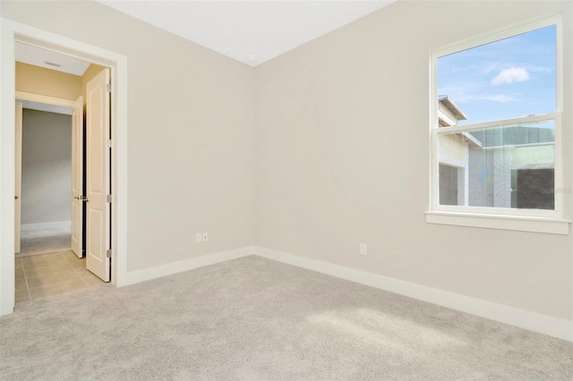 10714 Torchwood Sea Way, San Antonio, FL 33576 - spare room featuring baseboards and light colored carpet