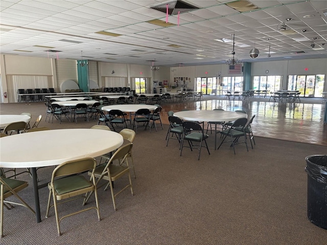 dining space featuring a drop ceiling