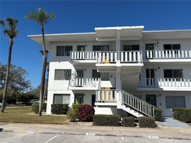 view of property featuring stairs