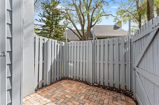 view of patio / terrace with a fenced backyard and a gate