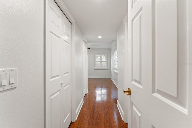 hallway with recessed lighting, dark wood finished floors, and baseboards