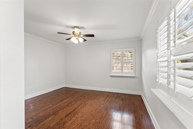 unfurnished room featuring ceiling fan, baseboards, dark wood finished floors, and crown molding