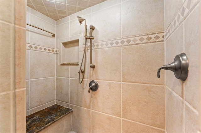 bathroom with tiled shower