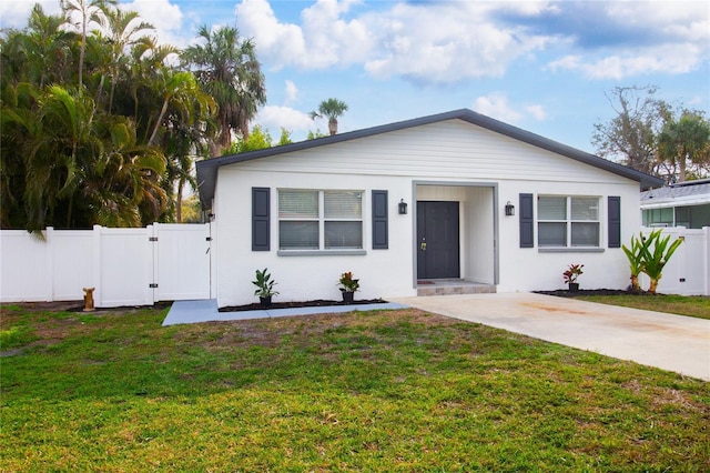 bungalow with a front yard, a gate, and fence