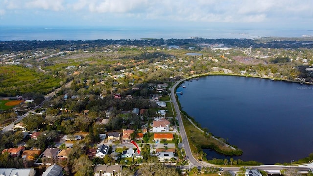 drone / aerial view with a residential view and a water view