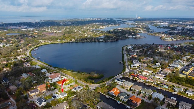 bird's eye view featuring a water view and a residential view